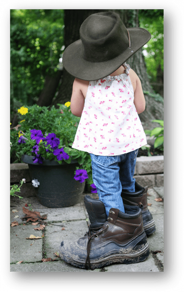 Big Shoes girl in the garden